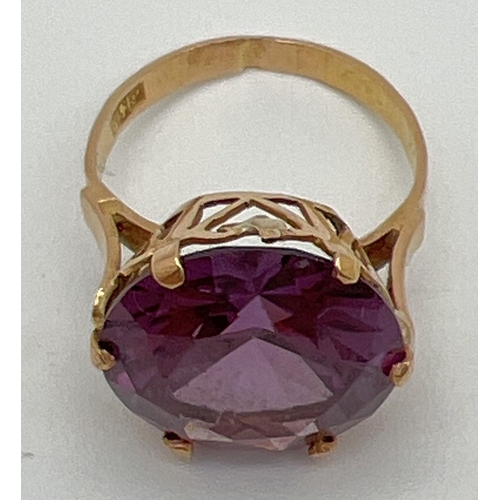 2 - An 18k Egyptian gold dress ring set with a large round cut purple amethyst. Pierced heart detail to ... 