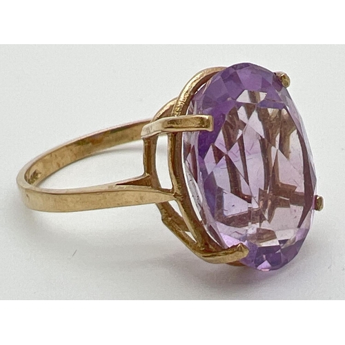 53 - A 9ct gold cocktail ring set with a large oval cut Rose de France amethyst. Stone approx. 16mm x 12m... 