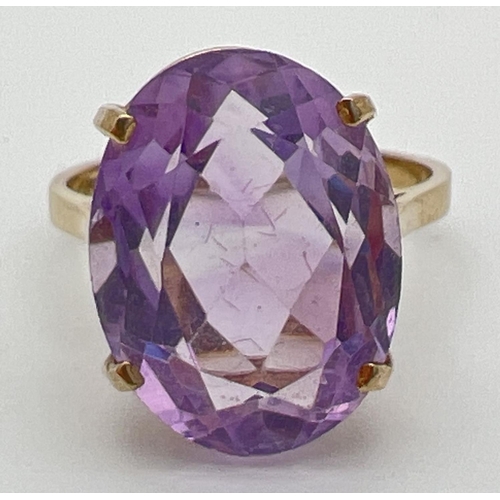 53 - A 9ct gold cocktail ring set with a large oval cut Rose de France amethyst. Stone approx. 16mm x 12m... 