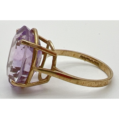 53 - A 9ct gold cocktail ring set with a large oval cut Rose de France amethyst. Stone approx. 16mm x 12m... 