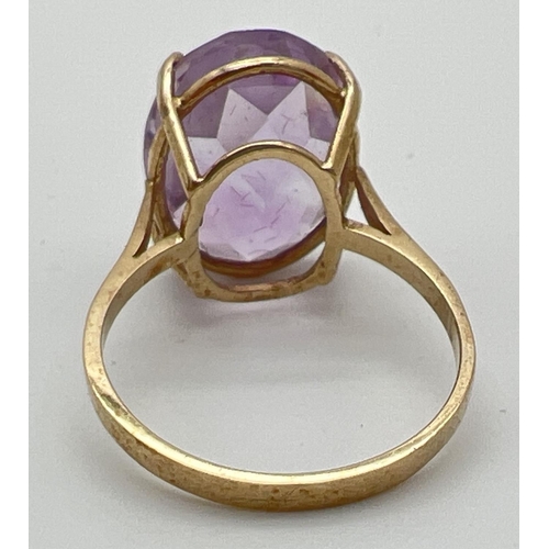 53 - A 9ct gold cocktail ring set with a large oval cut Rose de France amethyst. Stone approx. 16mm x 12m... 