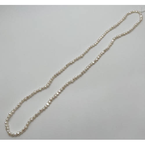 58 - A 34 inch string of white freshwater potato pearls.