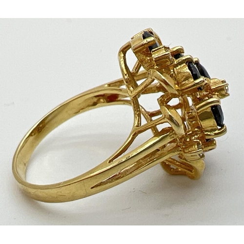 77 - A 14k gold large open design mount dress ring set with sapphires and diamonds. 8 teardrop cut midnig... 