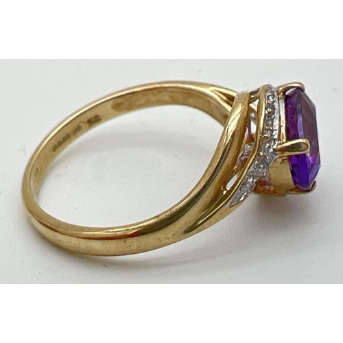 79 - A 9ct gold amethyst and diamond ring with twist design mount. A central oval cut amethyst with 5 sma... 