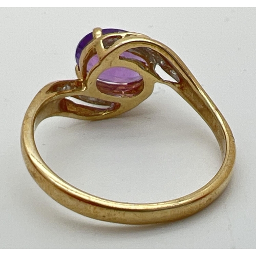 79 - A 9ct gold amethyst and diamond ring with twist design mount. A central oval cut amethyst with 5 sma... 