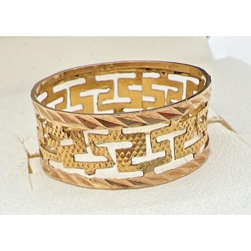 86 - A 14k gold band/wedding ring with pierced work Greek key design. 7mm band width. Marked 585. Total w... 