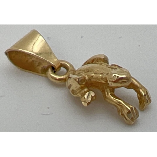 88 - A 14k gold pendant/charm in the shape of a frog. Bale marked 14K. Approx. 2cm long (including bale),... 