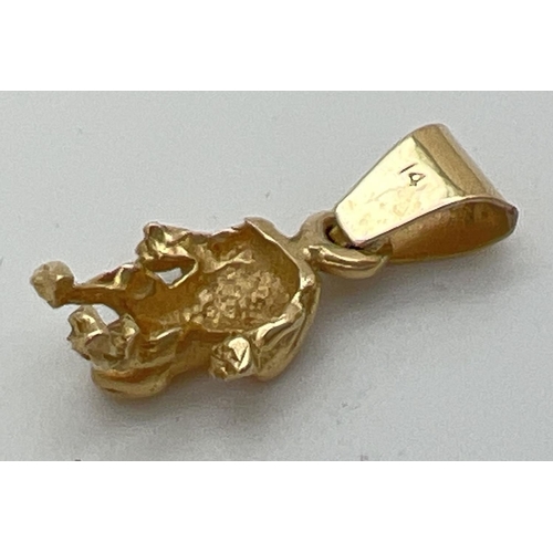 88 - A 14k gold pendant/charm in the shape of a frog. Bale marked 14K. Approx. 2cm long (including bale),... 