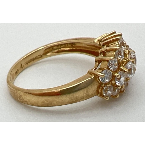 90 - A 14ct gold claw set cluster ring with 19 round cut Diamonique cubic zirconia stones. Full hallmarks... 