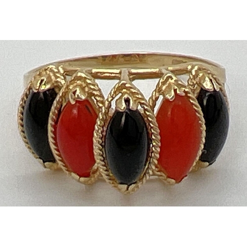 91 - A 14K gold cathedral style dress ring set with marquise cut black onyx and carnelian stones. Gold ma... 