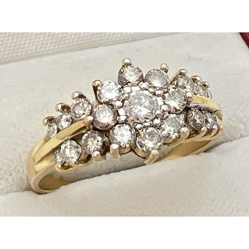 30 - An 18ct gold .70ct diamond cluster style ring. Central round cut diamond surrounded by 8 small round... 