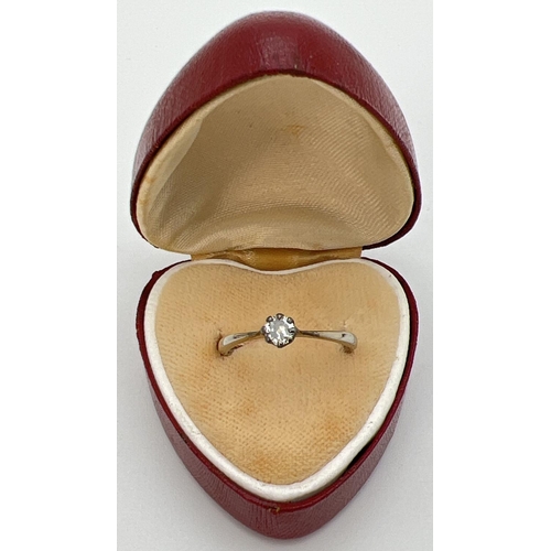 97 - An antique 18ct white gold and platinum .20ct diamond solitaire ring. Gold marks to inside of band. ... 