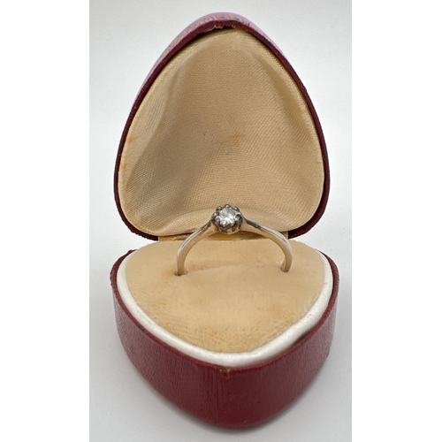 97 - An antique 18ct white gold and platinum .20ct diamond solitaire ring. Gold marks to inside of band. ... 