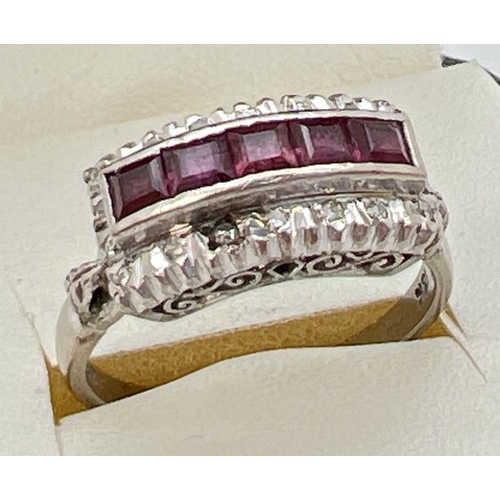 101 - An Art Deco 18ct white gold ruby and diamond dress ring. 5 .16ct square cut rubies in a central high... 