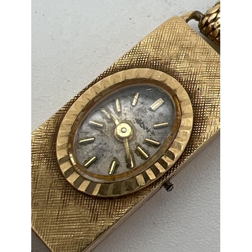 36 - A vintage 18ct gold ladies wristwatch by Cortebert. Gold case and mesh strap with hallmarks to insid... 