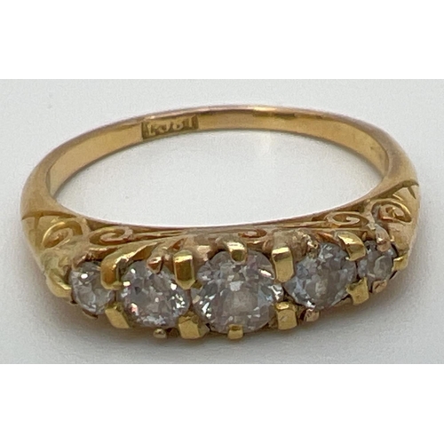 105 - An antique 18ct gold .50ct diamond ring. 5 graduating round cut diamonds in a boat style mount with ... 