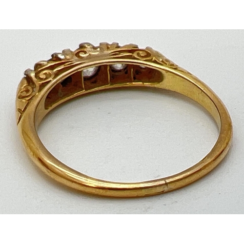 105 - An antique 18ct gold .50ct diamond ring. 5 graduating round cut diamonds in a boat style mount with ... 