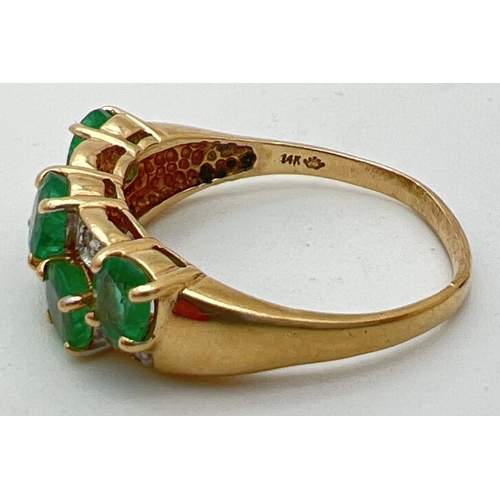 110 - A vintage style 14K gold, emerald and diamond dress ring. Two rows of oval cut emeralds with alterna... 