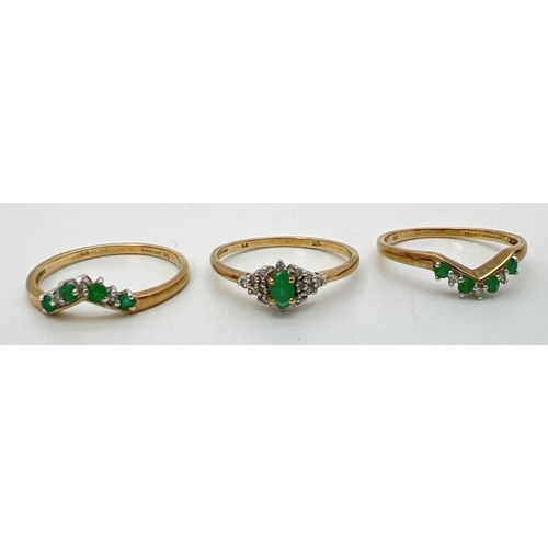 16 - A 9ct gold emerald and diamond triple ring/bridal set. Central ring set with a marquise cut emerald ... 