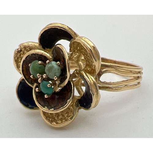 115 - A vintage 18ct gold bespoke made dress ring in the shape of a flower with 3 midnight blue enameled p... 