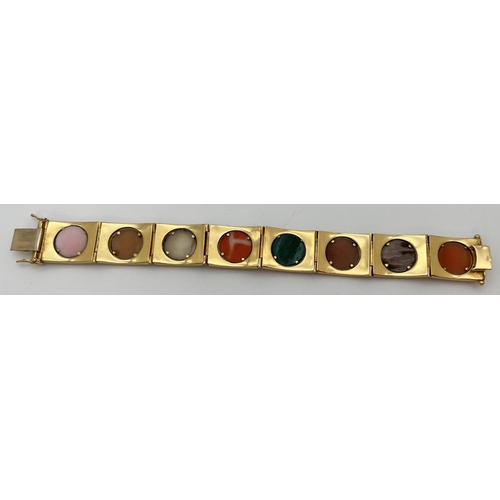 11 - A vintage 8 panel 18ct brushed gold bracelet set with varying colour semi-precious stone cameos. Pus... 