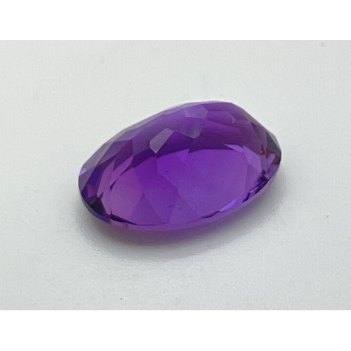 121 - An oval facet cut loose amethyst gemstone, suitable for jewellery making. Approx. 8ct.