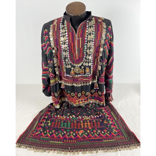 384 - A vintage embroidered tunic from Central Asia. Heavily embroidered in pink, green, purple and orange...