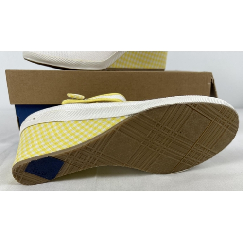 A boxed pair of canvas yellow and white Sarenza wedge heel