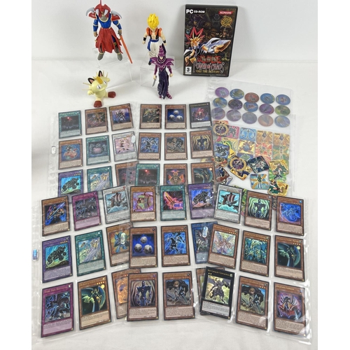 15 - Collection of Yu-Gi-Oh trading cards, toys and collectables. Comprising: 45 Ultra Rare trading cards... 