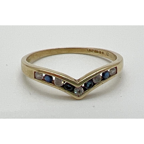 1142 - A 9ct gold wishbone style dress ring set with alternating small round cut cubic zirconia stones and ... 