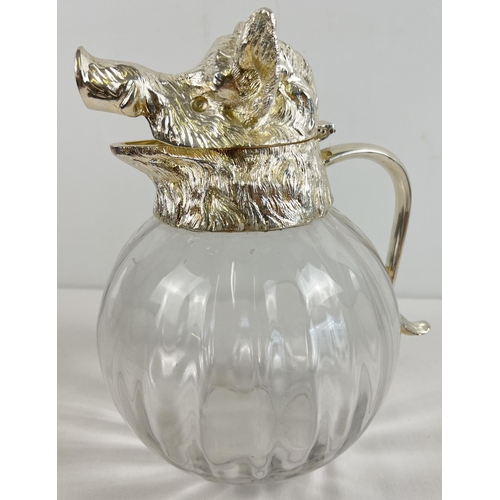 1195 - A large heavy bulbous glass claret jug with silver plated hinged lid in the form of a boars head. Ho... 