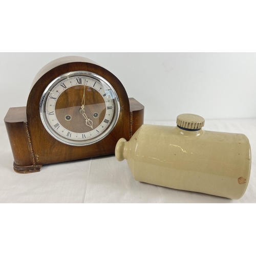 1212 - A vintage dark wood cased striking mantel clock together with stoneware Pearson, Chesterfield hot wa... 