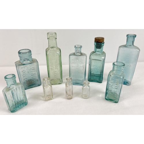 1242 - A collection of 10 assorted antique glass bottles to include advertising. Examples include: Eiffel T... 