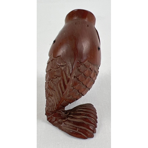 1258 - A small Japanese carved fruitwood pot in the form of an open mouthed fish. Set with small mother of ... 