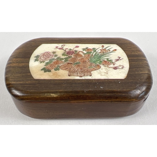 1259 - A small Japanese fruitwood wooden box, sliding lid has carved bone insert with floral decoration. In... 