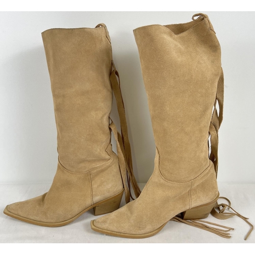 1337 - A pair of Cuban heeled pale tan soft suede pull on style cowboy boots with fringe wrap tassels by Th... 