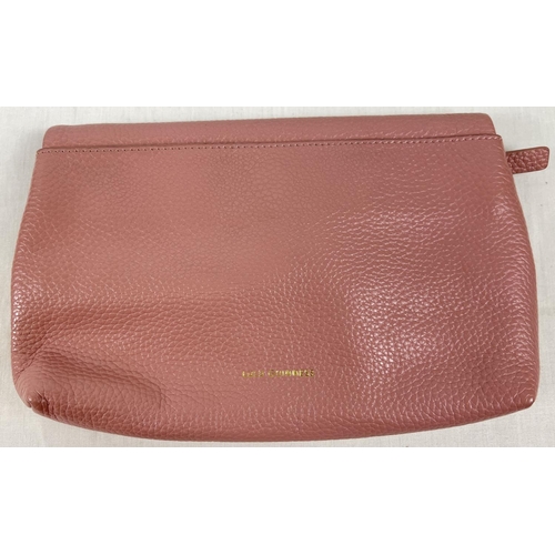 1338 - A pale pink leather clutch bag by Lulu Guinness with lips motif and gold hardware. External back poc... 