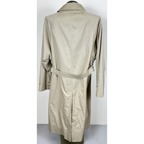 1332 - A beige belted long trench coat by Burberrys. Classic check full length lining, button front fasteni... 