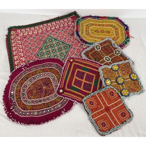 1320 - A collection of vintage Central Asian heavily beaded and embroidered fabric panels. In varying sizes... 