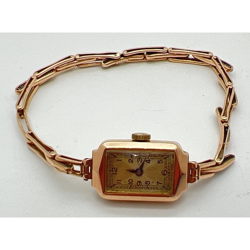 1150 - A ladies 9ct gold vintage 15 jewels Swiss made wristwatch. Rectangular shaped case with expanding br... 