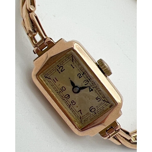 1150 - A ladies 9ct gold vintage 15 jewels Swiss made wristwatch. Rectangular shaped case with expanding br... 