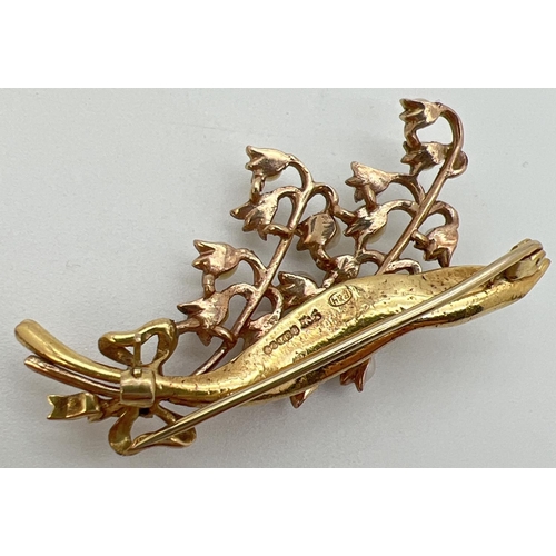 1004 - A 9ct gold and pearl brooch in the shape of a Lilley Of The Valley spray of flowers. Pin back with f... 