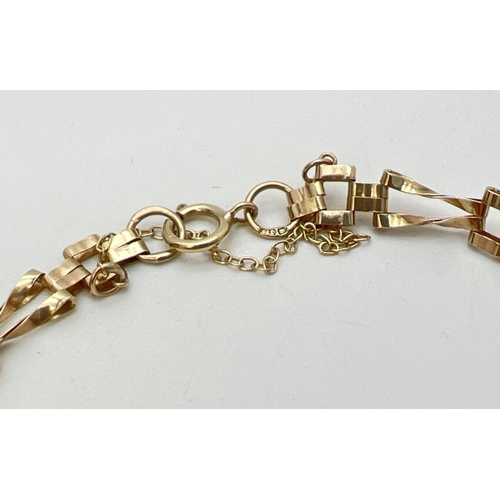 1036 - A 9ct gold decorative link bracelet with set 3 oval cut opal stones in bezel set mounts. With rope b... 