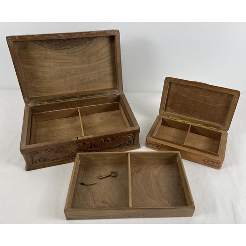 1281 - 2 carved wooden jewellery/trinket boxes. A box with lift out tray to interior, highly carved lid wit... 