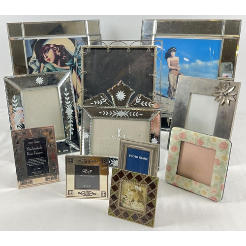 1282 - A collection of modern and vintage photo frames to include mirrored, Rennie Mackintosh design and fa... 