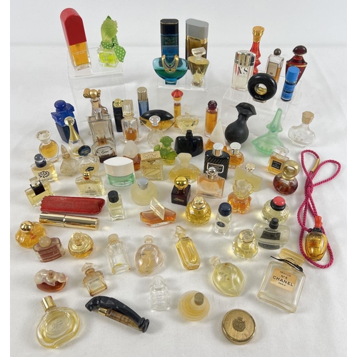 1315 - A collection of miniature perfume bottles, most with contents. To include examples by Dior, Yves St ... 