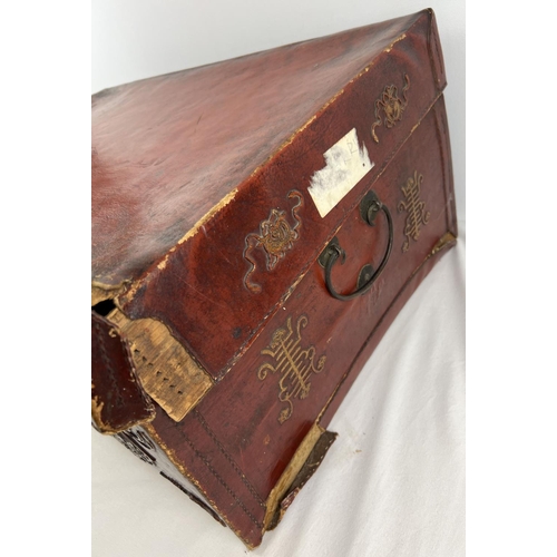 1288 - A vintage red leather trunk with Oriental floral & character relief design to front & sides. Drop me... 