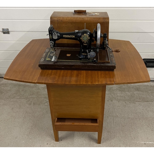 1350 - An early 20th century Jones CWS Federation Family hand sewing machine in a vintage sewing machine ta... 