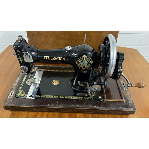 1350 - An early 20th century Jones CWS Federation Family hand sewing machine in a vintage sewing machine ta... 