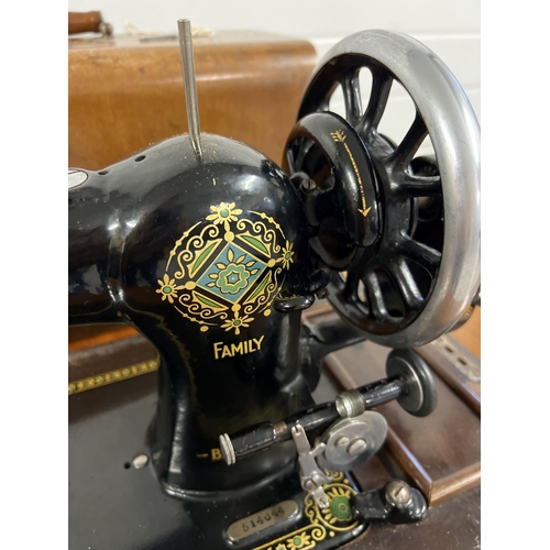 1350 - An early 20th century Jones CWS Federation Family hand sewing machine in a vintage sewing machine ta... 